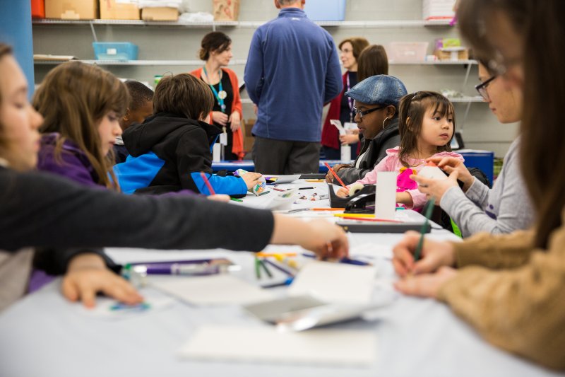 People of all ages making art in the classrooms