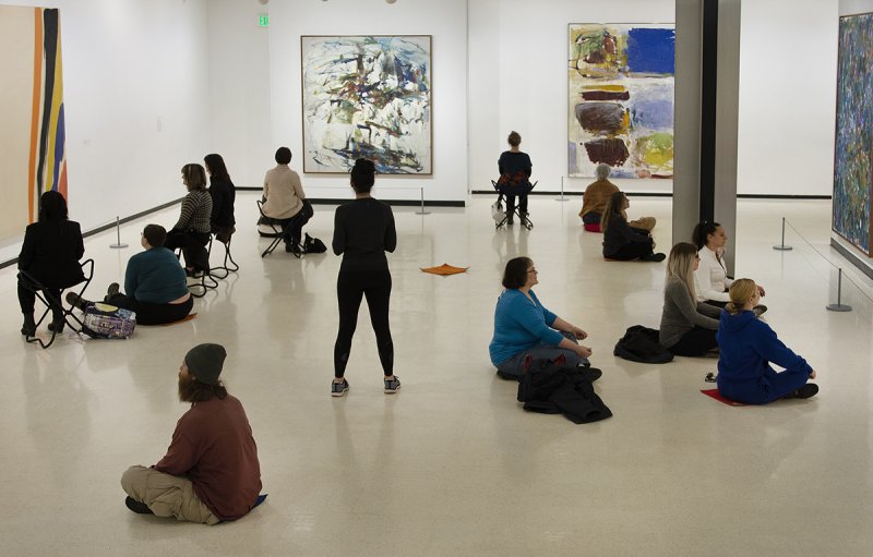 Guests meditate in the Lower Level East Gallery