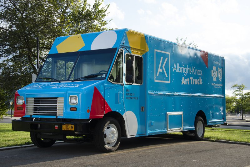 A large blue truck with the words "Art Truck" on the side