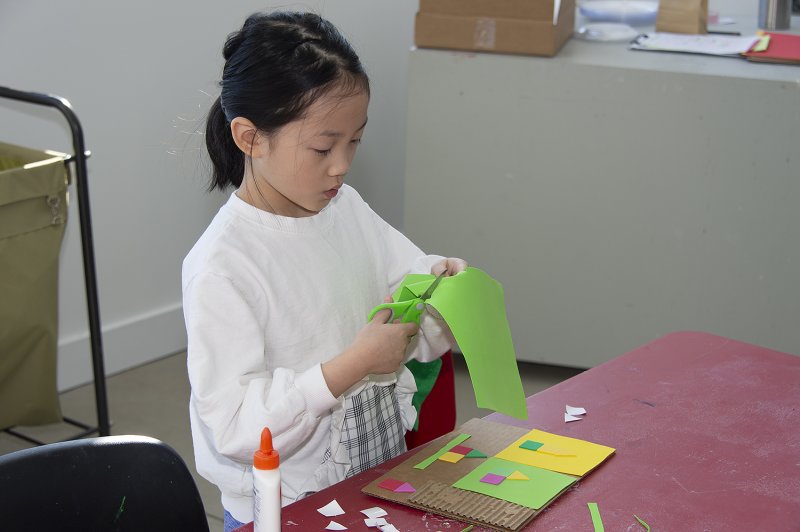 A girl cutting paper