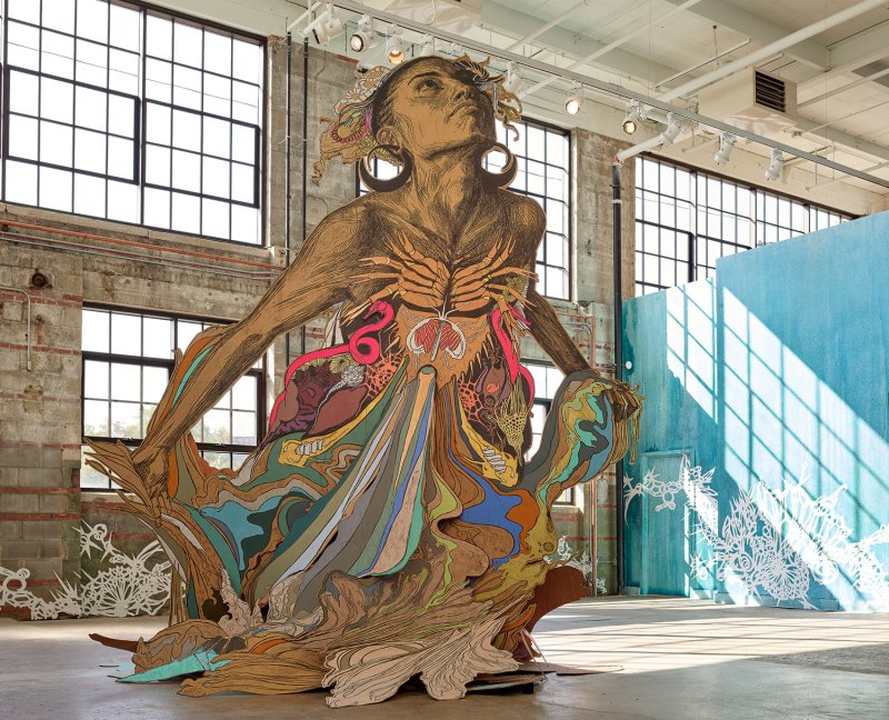 A large sculpture of a female figure