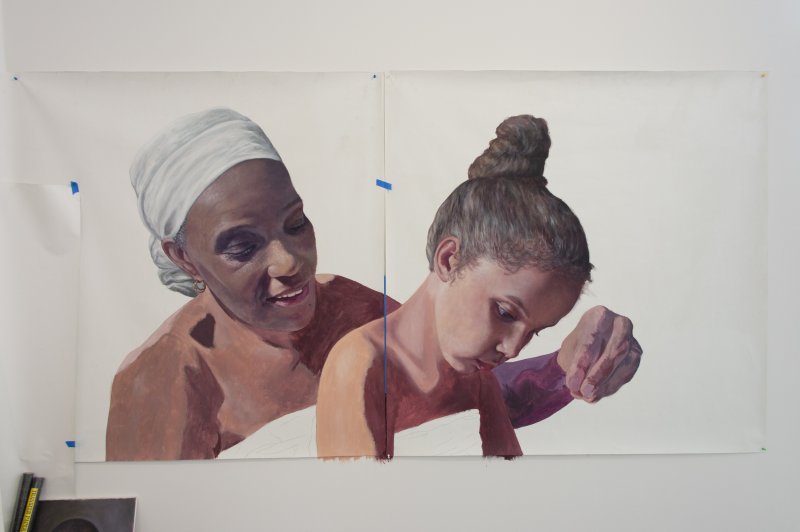 A painting of a Black woman and a Black girl on a large piece of white Polytab material hung on a large white wall