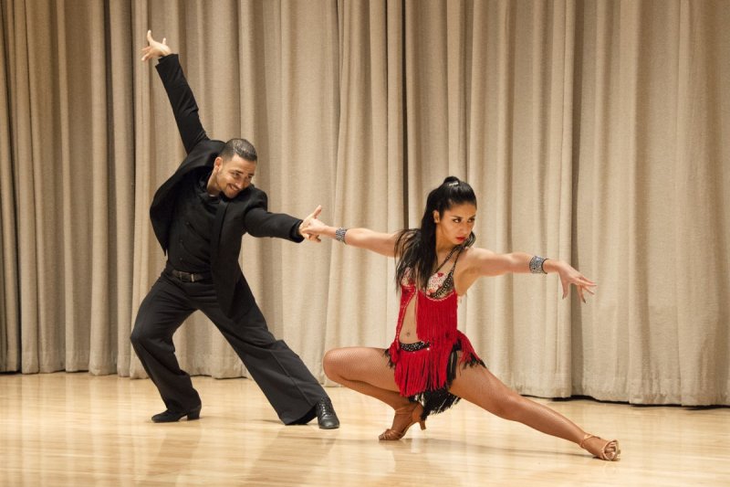 A man and woman posing mid salsa dance 