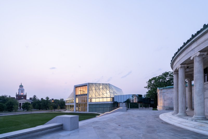 Photo of two adjacent museum buildings at sunset