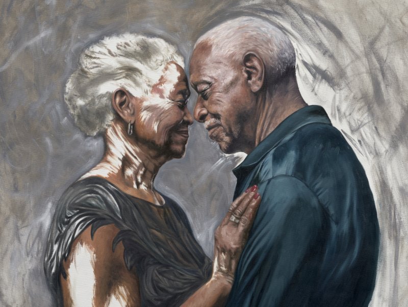 A close up of an oil painting of an older black man and woman in a close embrace, with their foreheads touching and the woman's hand resting on the man's chest 