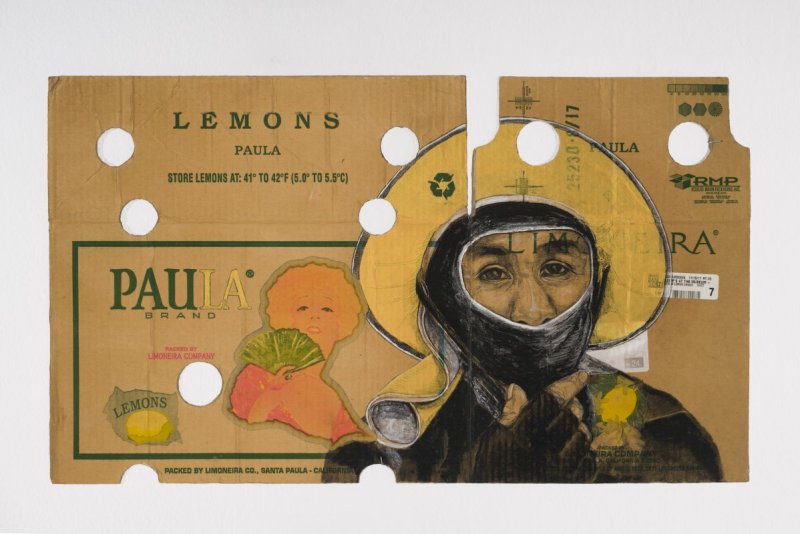Portrait of a person in black with their mouth covered and wearing a straw hat, drawn on a produce box for oranges
