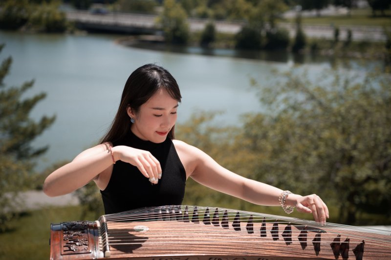 A woman playing a Guzheng
