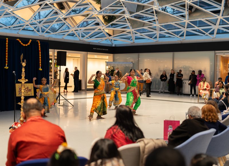 Three dancers in traditional Indian clothing 
