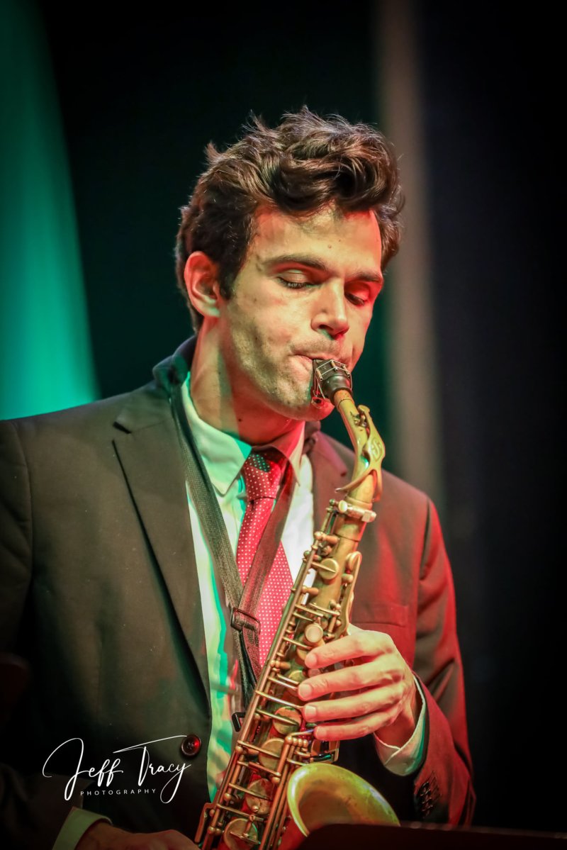 A person playing the saxophone