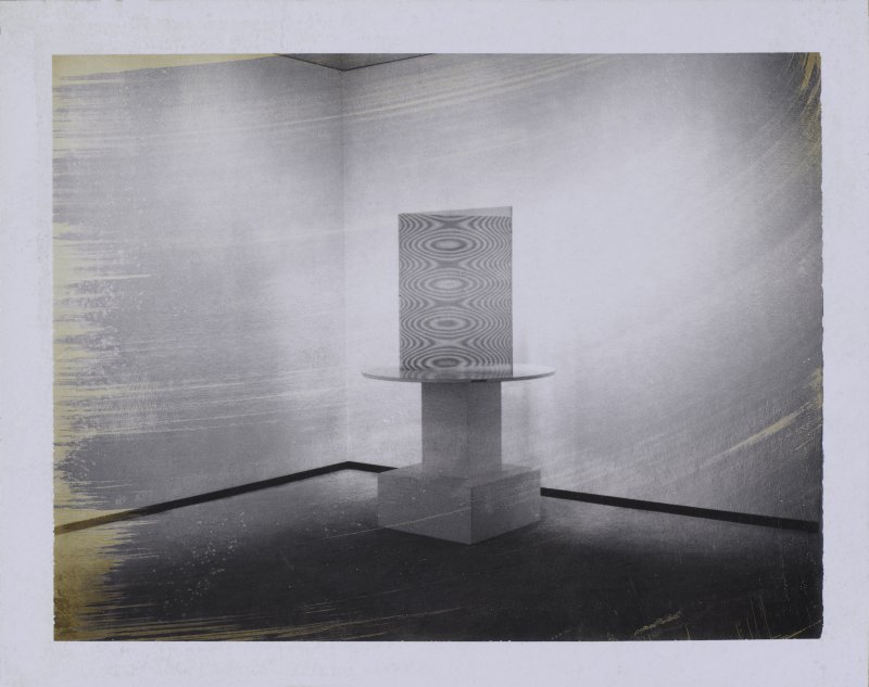 Black and white image of an Op art sculpture in a empty gallery space 