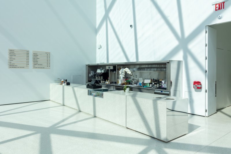 A coffee bar in a bright, white room
