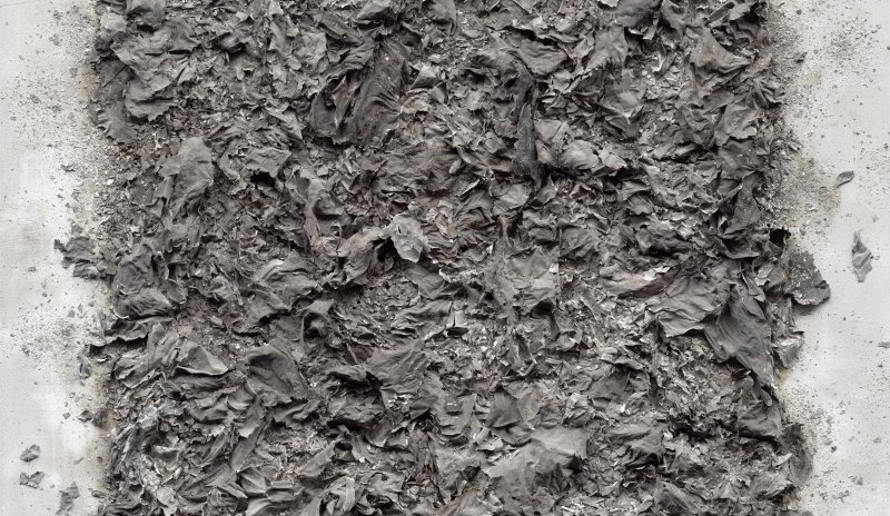 Closeup of a grey textured artwork