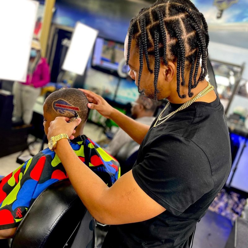 A barber cutting someone's hair