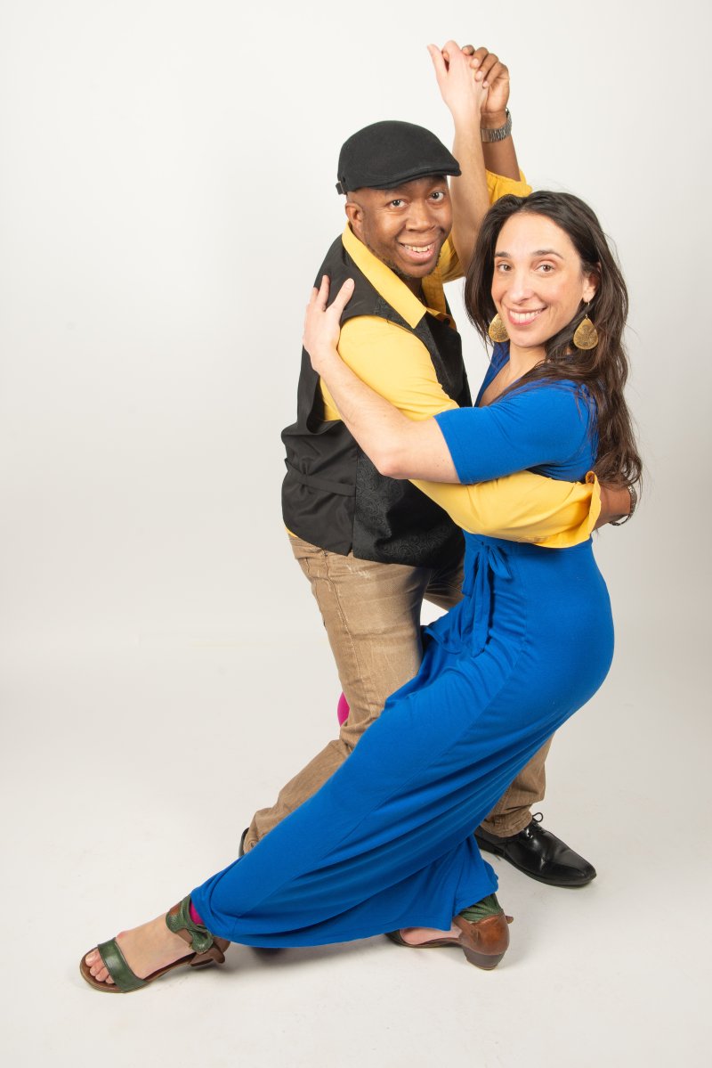 A couple posing mid-dance