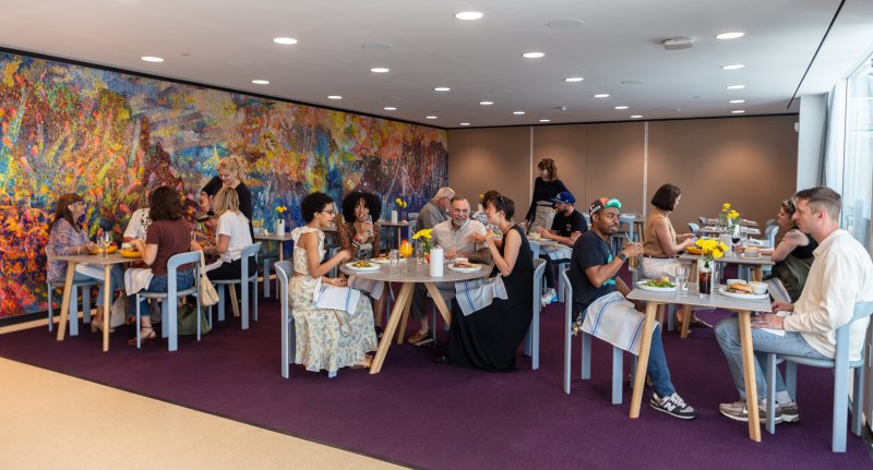 Visitors in the dining room in Cornelia at the Buffalo AKG Art Museum. Photo: Jeff Mace