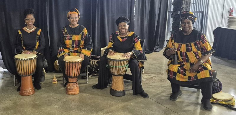 Four people with drums