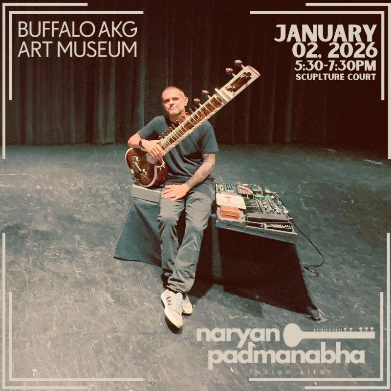 A man holding a sitar