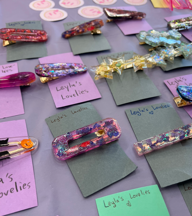 Colorful clips mounted on colorful squares of paper