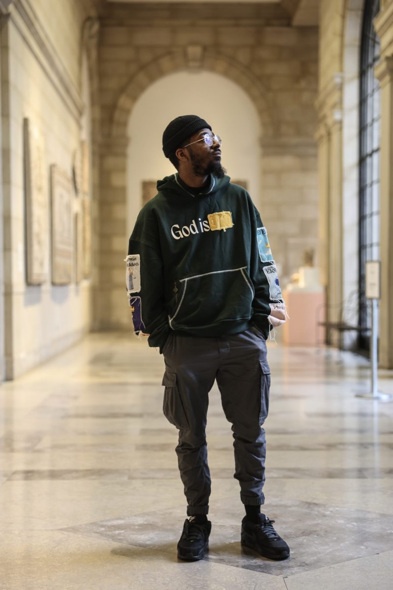 A person wearing all black in a marble building