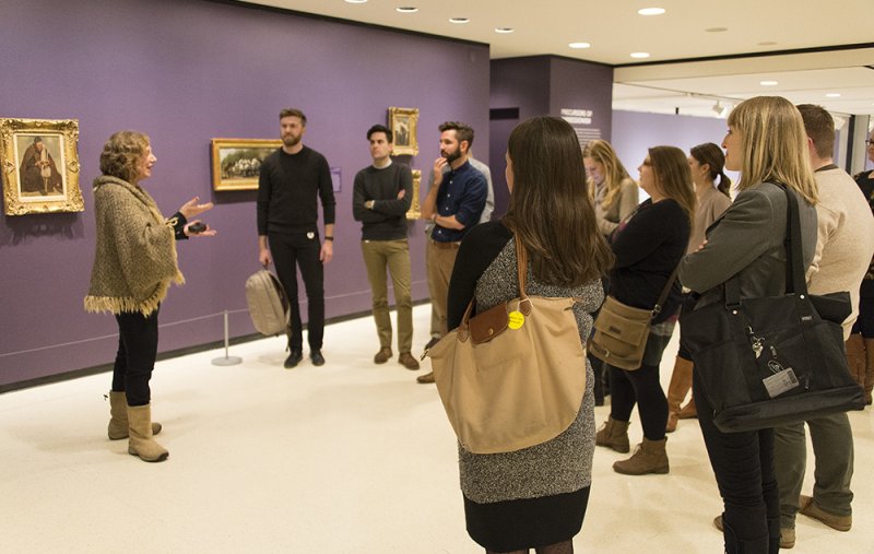 An AK docent leads a public tour