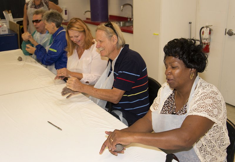 Veterans work on an art project following a tour of the museum as part of the Veterans Connecting through Art program.