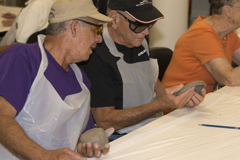 Veterans work on an art project following a tour the museum as part of the Veterans Connecting through Art program