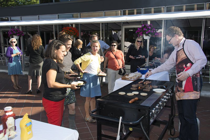 Deputy Director Joe Lin-Hill grills for teachers in the Sculpture Garden