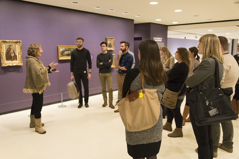 An AK docent leads a public tour