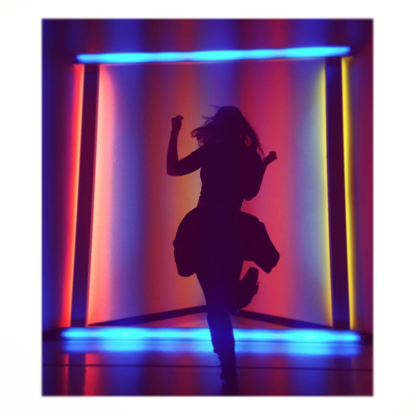 Woman dancing in front of Dan Flavin's untitled (to Donna) 6, 1971
