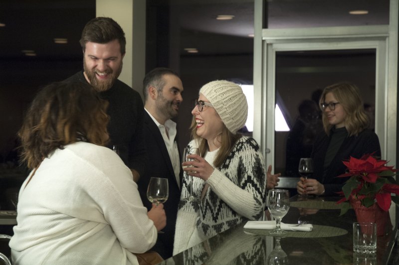 Guests enjoy a holiday reception in AK Cafe