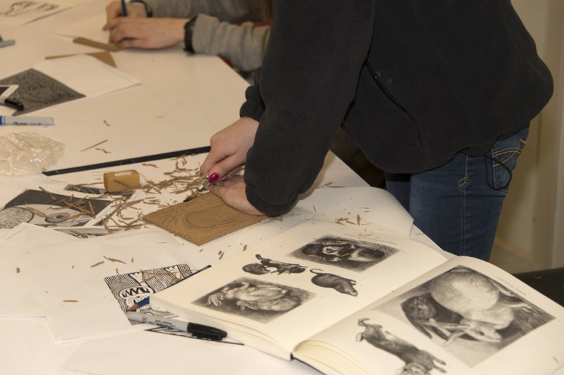 A student working on a printmaking project