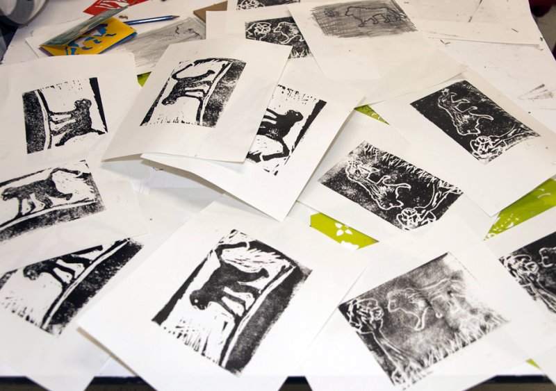 Prints of animals scattered on a table