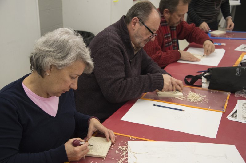 Adults making art in the classroom