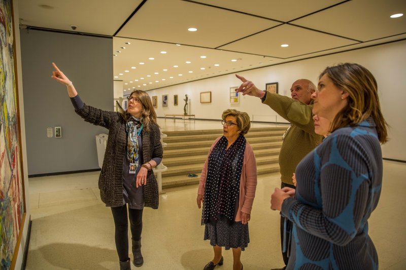 Adults on a public tour in front of Willem de Kooning's Gotham News