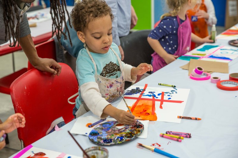 Young children making art in the classroom