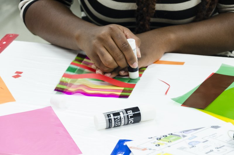 A child making art in the classroom