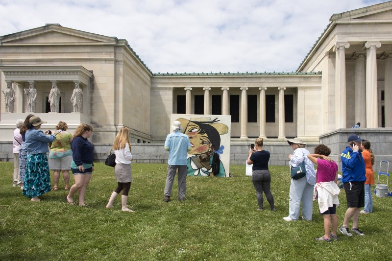 Guests view Grand Island High School Art Club's re-creation of Pablo Picasso’s Portrait de Femme Au Col d'Hermine (Olga), 1923