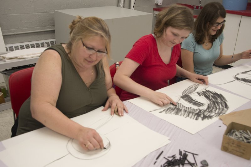 Adults drawing in the classroom