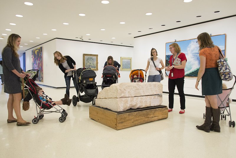 Parents with babies in strollers on a tour