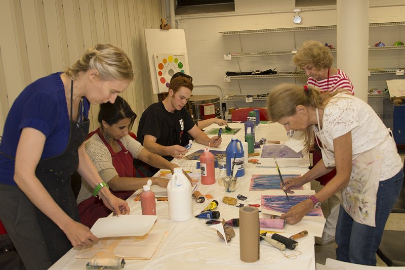 Adults making art in the classrooms