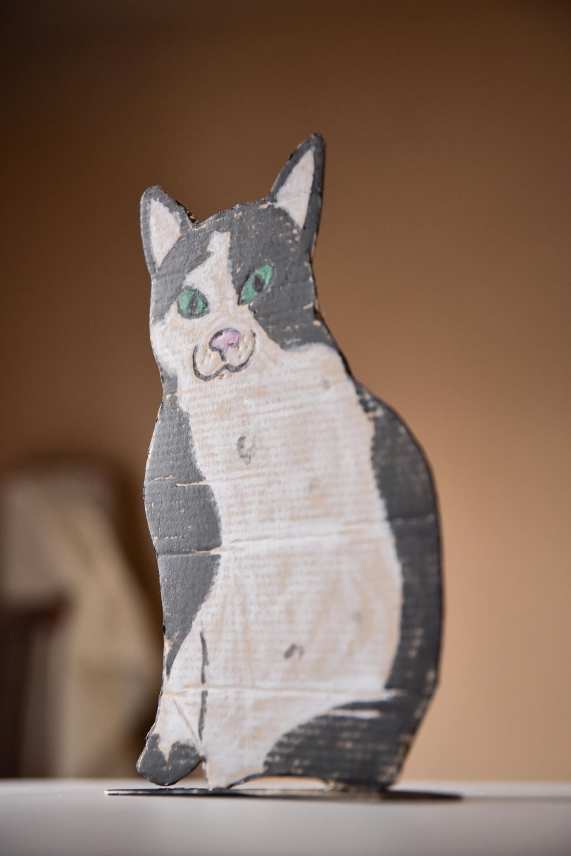 A cardboard sculpture of a cat