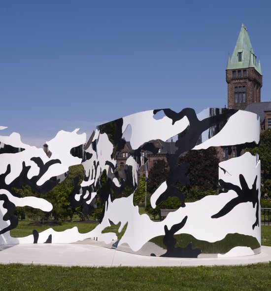A large black, white, and mirrored chrome sculpture in a camouflage pattern