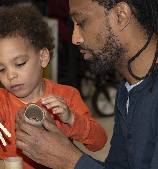 A man and a boy making art