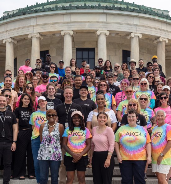 A group of people standing on stairs posing for a photo