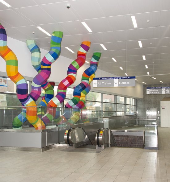 Six 11-foot-tall sculptures with different colored segments
