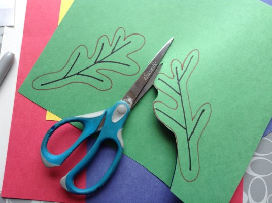 Cut leaf shapes out of multicolored construction paper. Write a